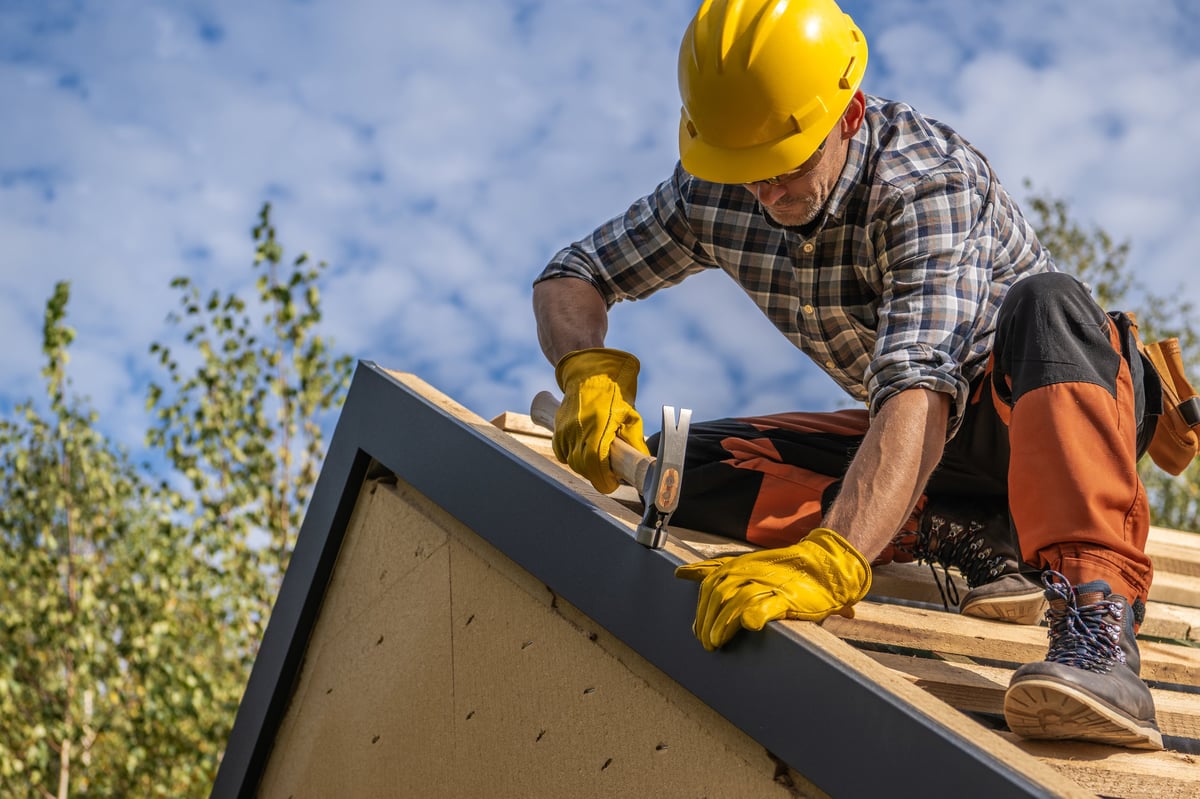 ACO Roofing & Gutters roofing contractor at work on a Dallas home